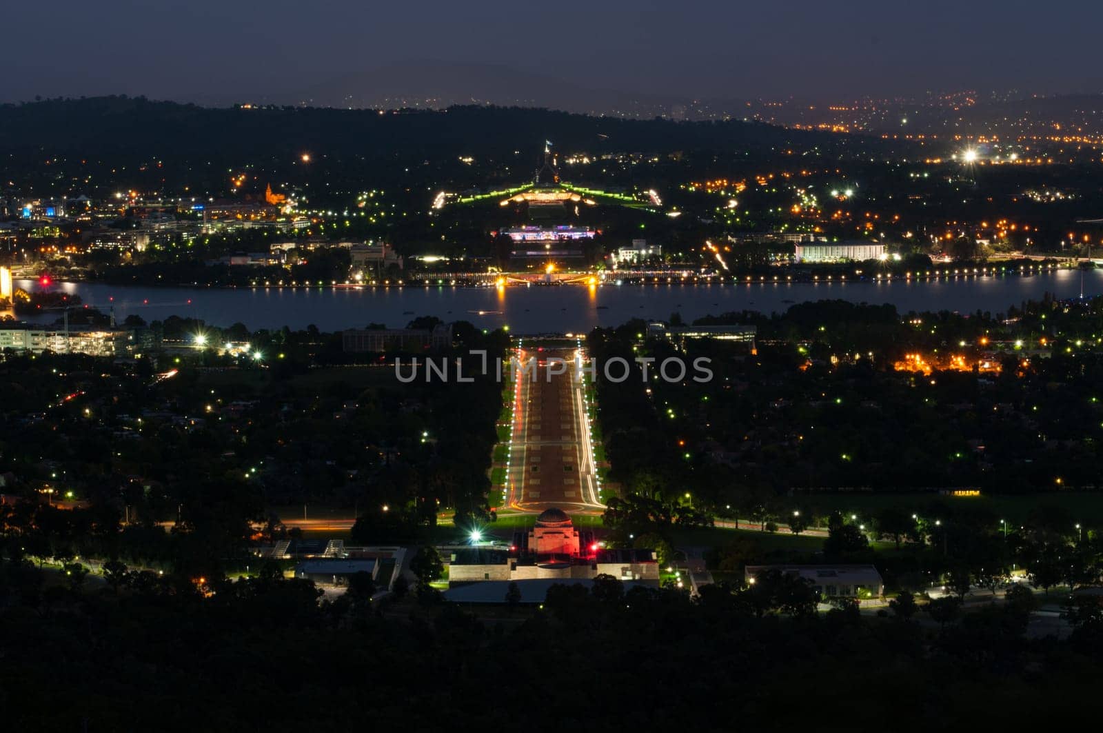 View of Canberra city by night, overlooking the Australian War Memorial, Lake Burley Griffin and the Parliament House
