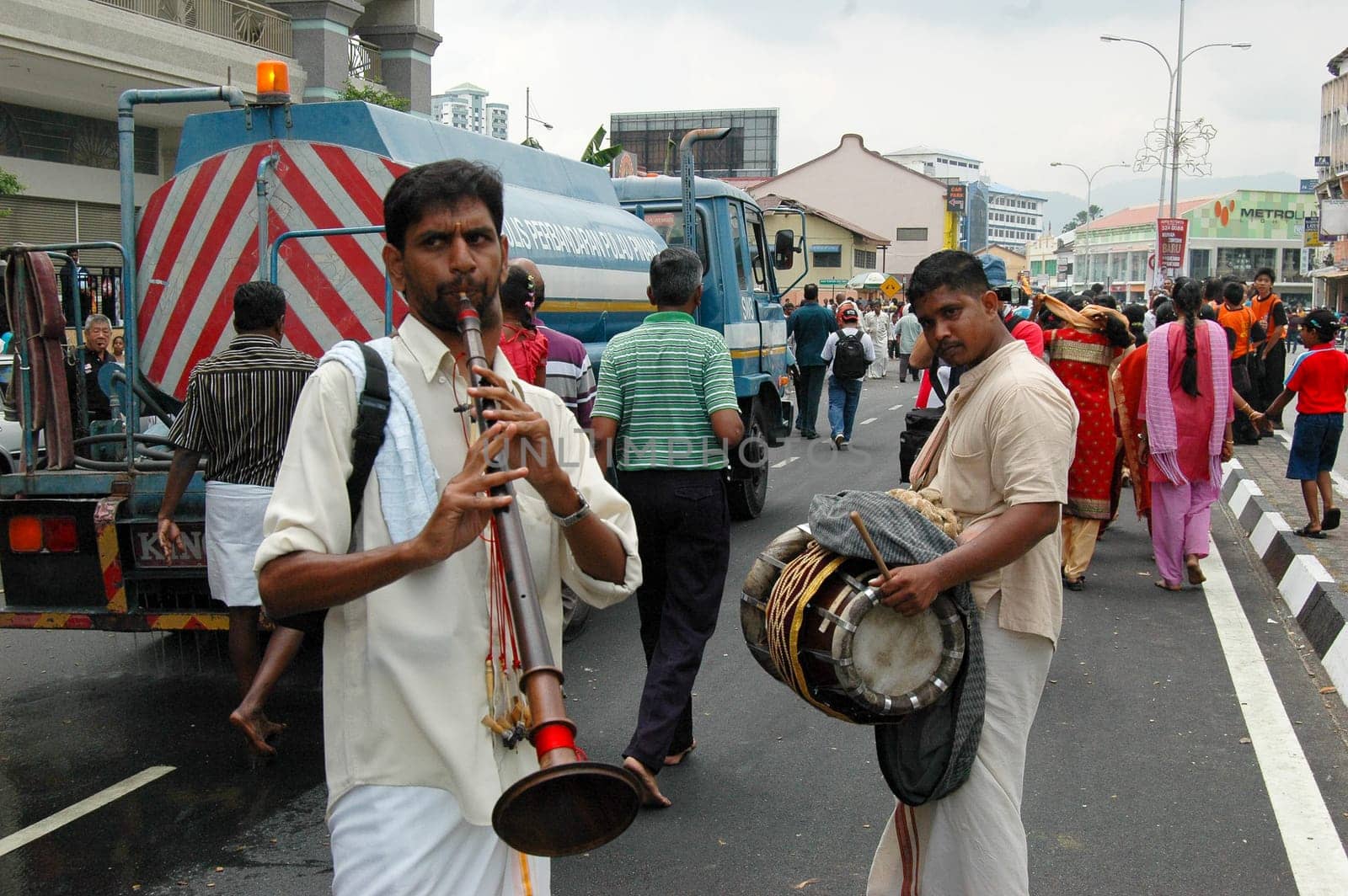 7 February 2009 - Georgetown, Penang: A pair of street musicians add revelry to the Thaipusam procession in Penang
