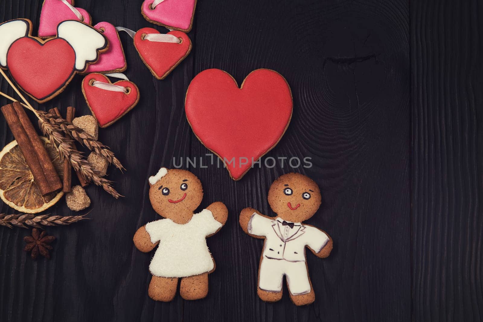 Gingerbreads for Valentines Day on dark concrete background