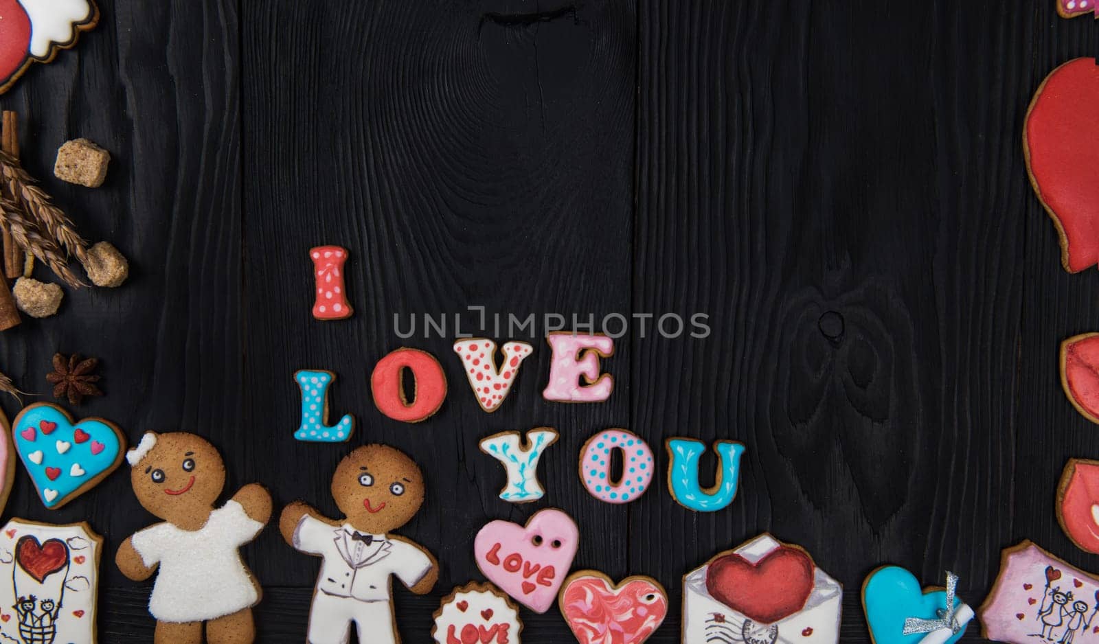 Gingerbreads for Valentines Day on dark concrete background