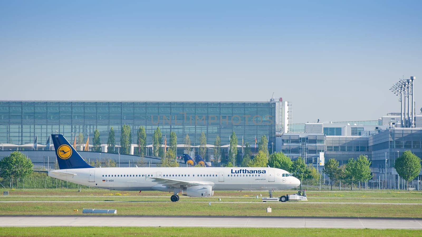 Munich, Germany - May 6, 2016: Jet airliner Airbus A321-231 of Deutsche Lufthansa AG airlines after landing taxiing on pushback tug at Munich international passenger airport