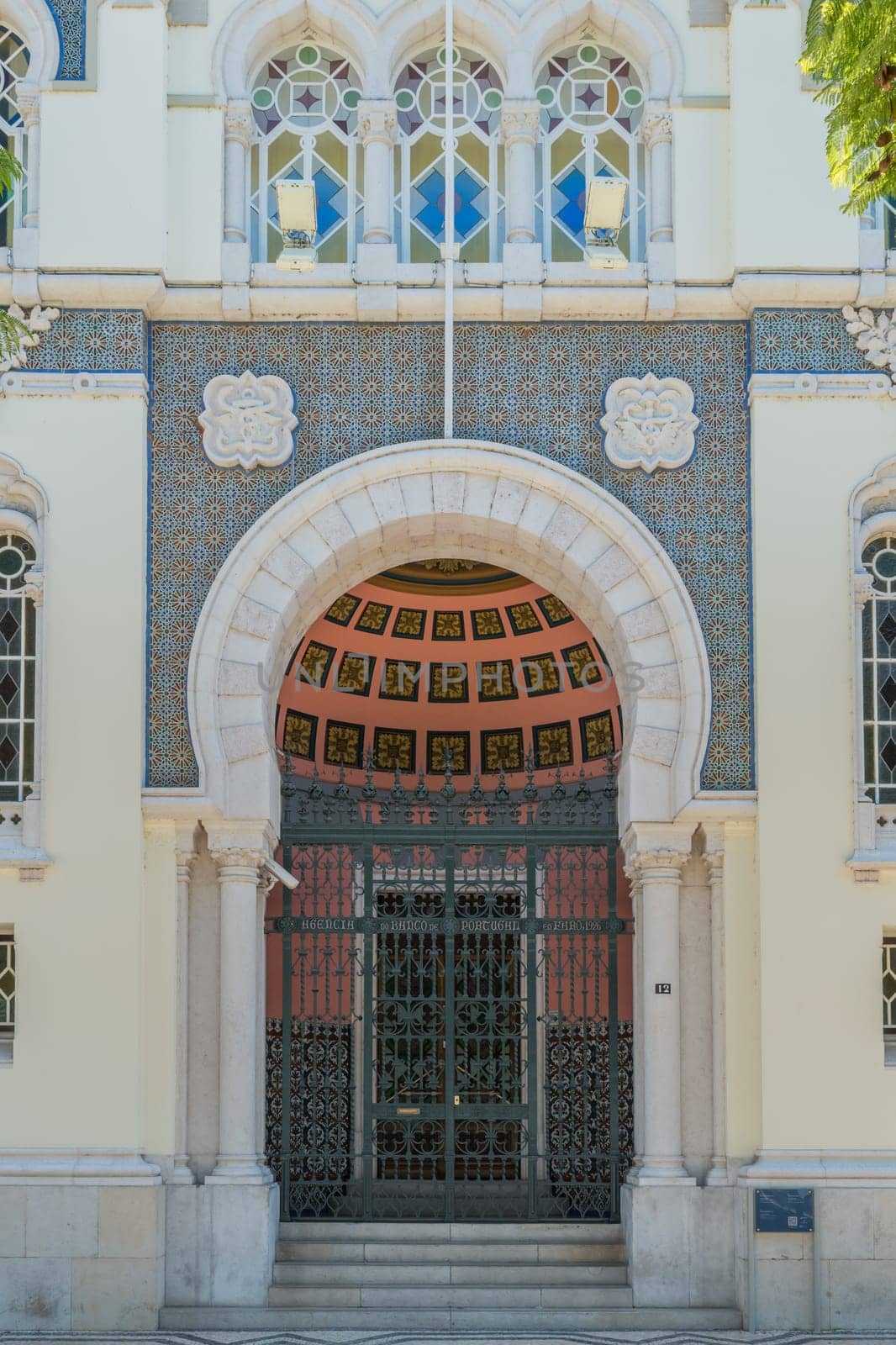 FARO, PORTUGAL - OCTOBER 01, 2016: Banco de Portugal Building in the city of Faro, Algarve, Portugal. Neo-Manueline Revivalist Architecture, with Islamized suggestions at the front door.
