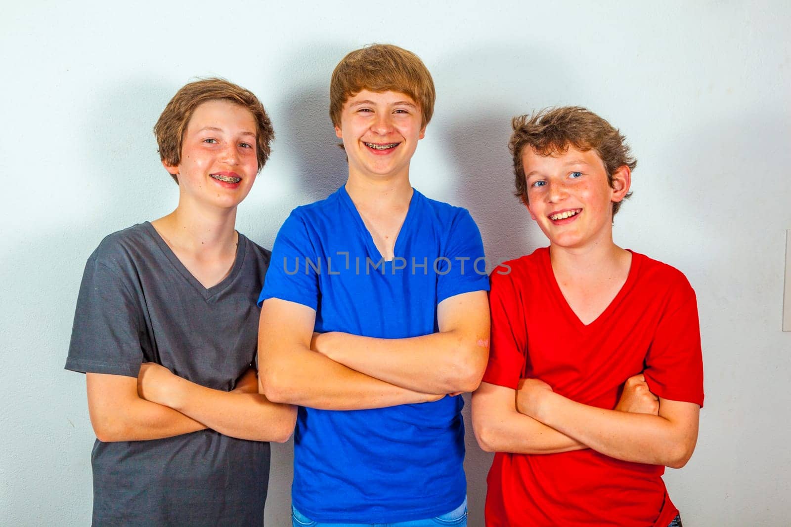 three happy joyful friends enjoy life