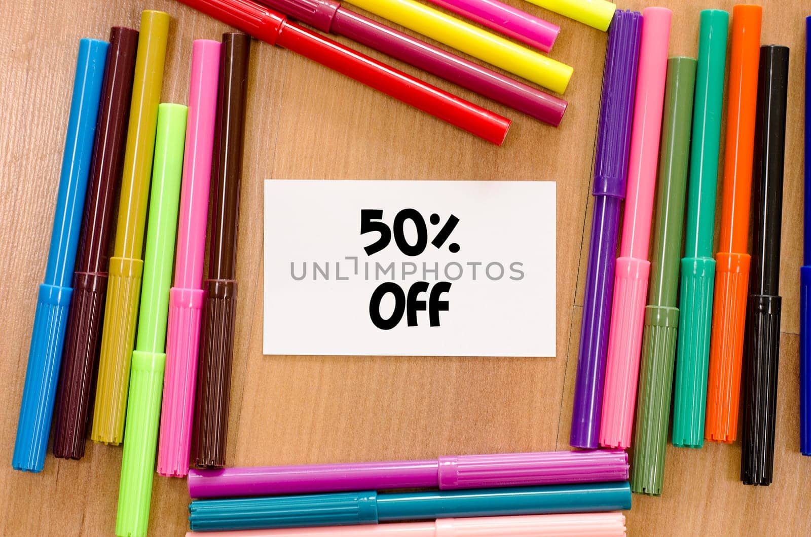 Felt-tip pen and memo on a wooden background and text concept