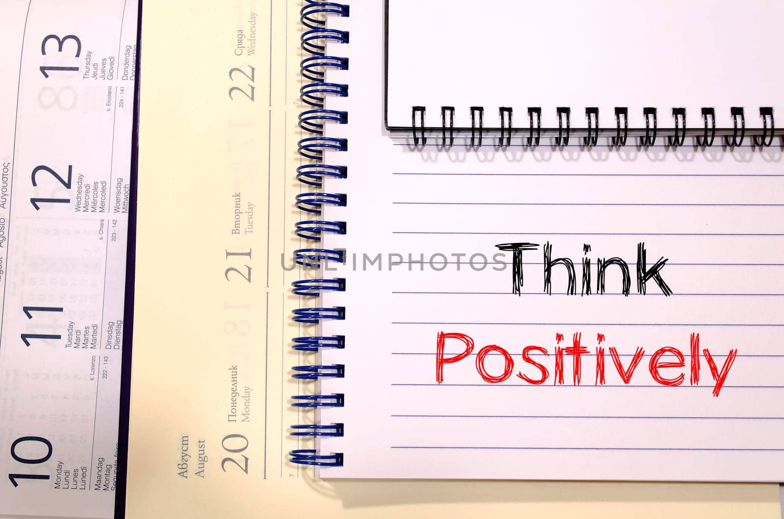 Think positively text concept write on notebook