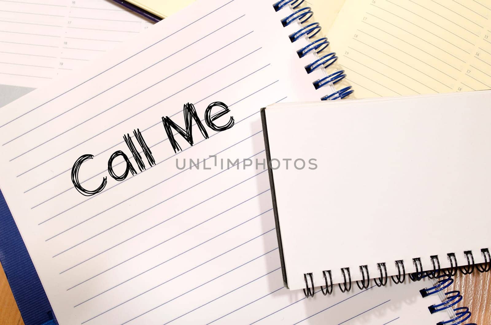 Call me text concept write on notebook