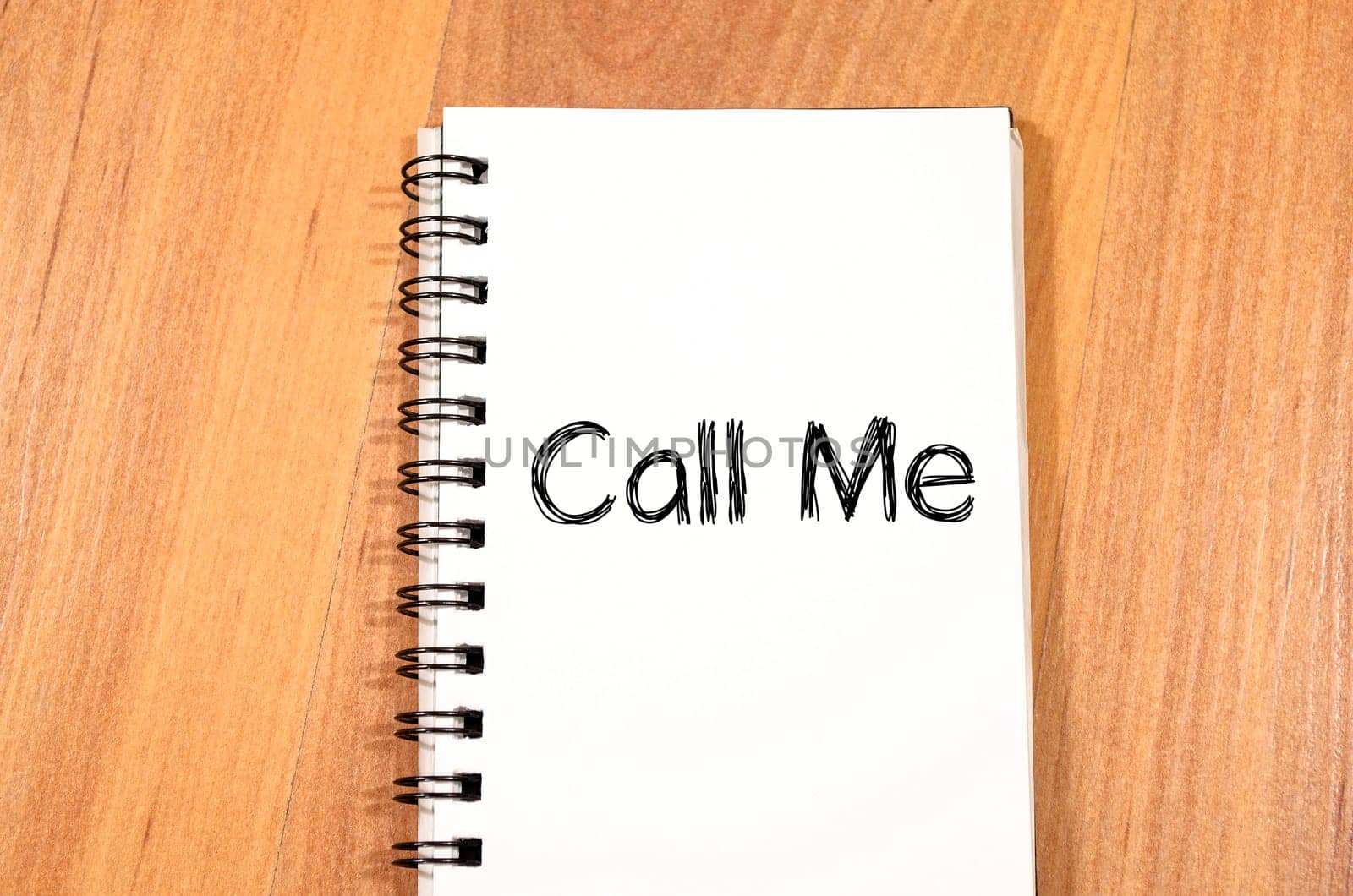 Call me text concept write on notebook