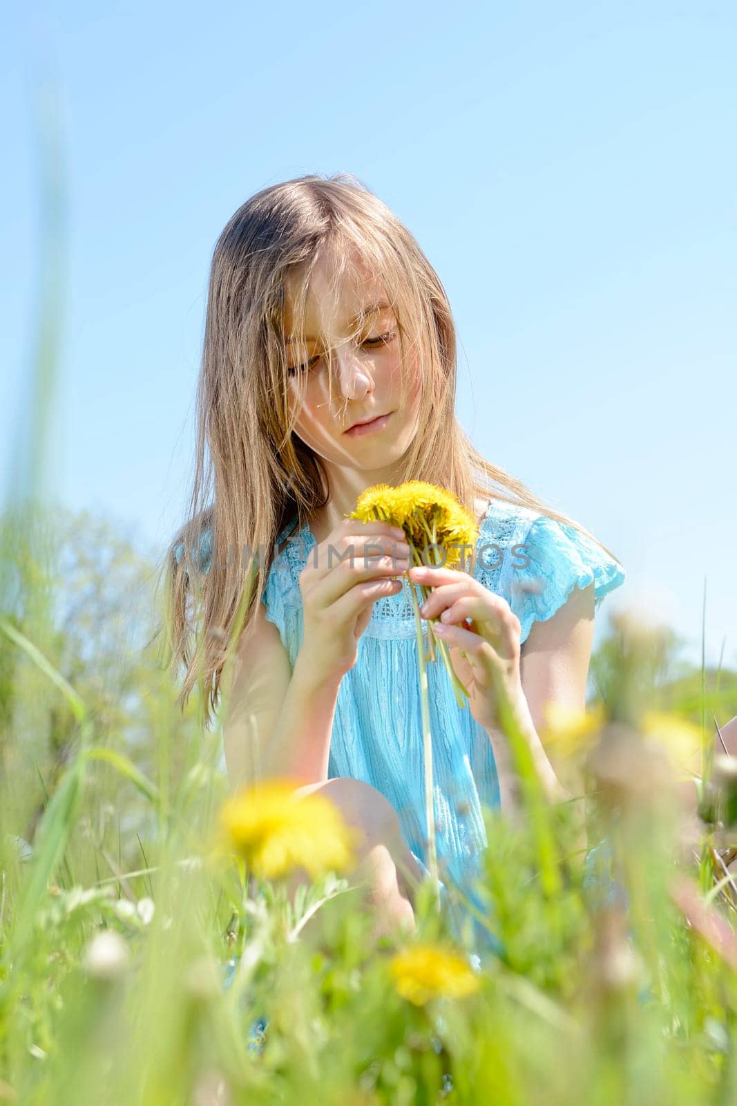 Girls with dandelions
