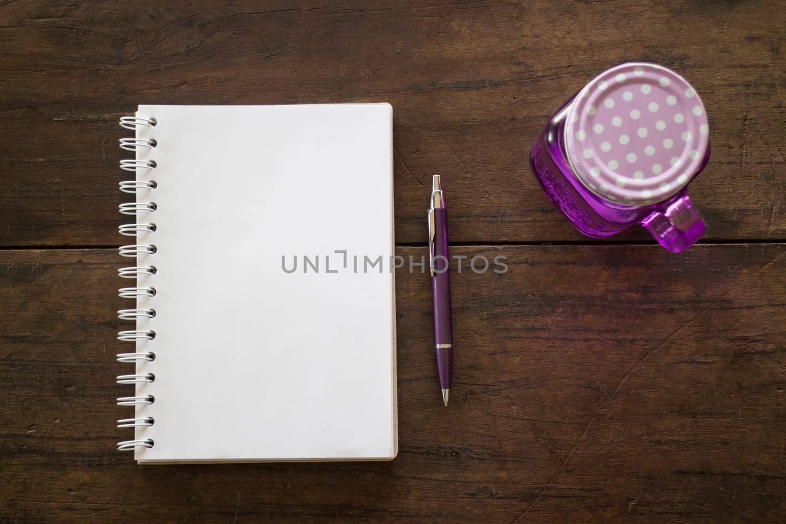 Notepaper, pen and drink on wooden table, stock photo