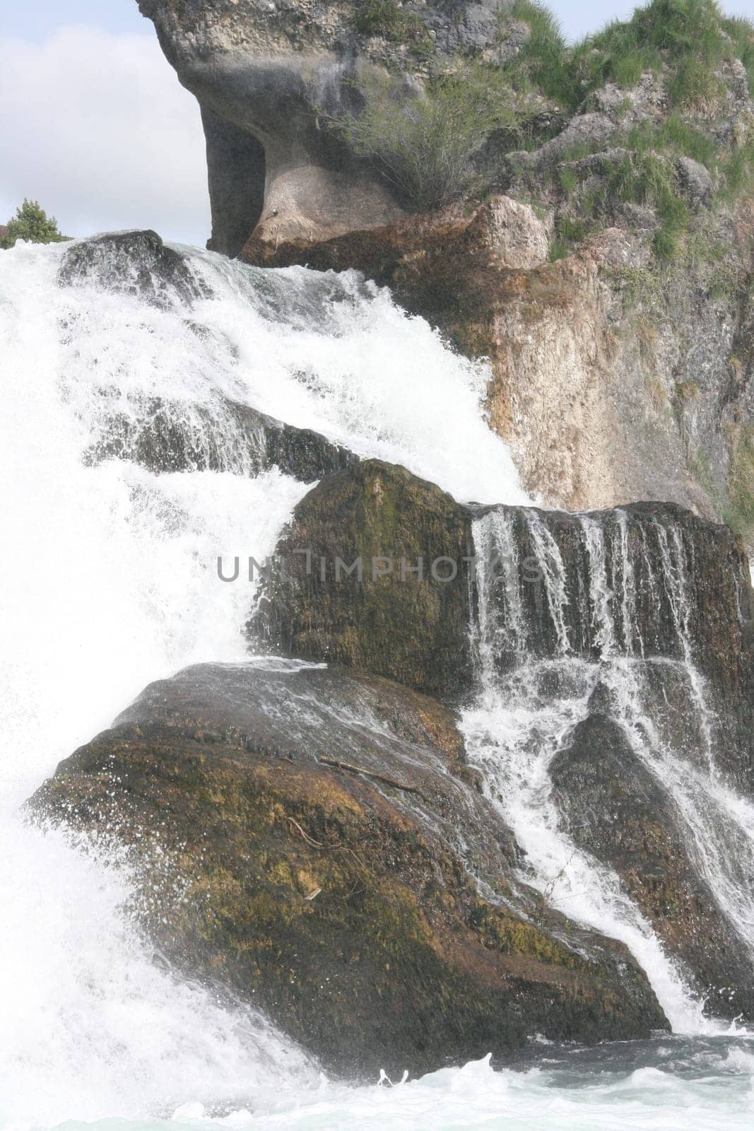 Waterfall with white,foaming spray