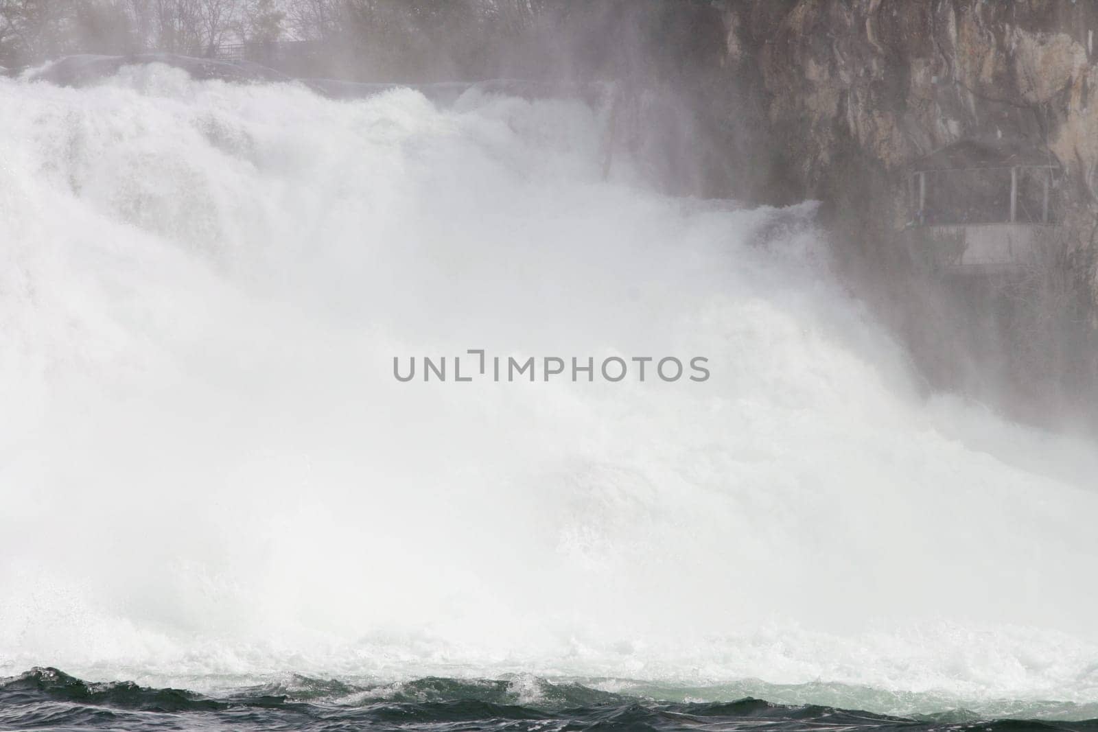 Waterfall with white,foaming spray