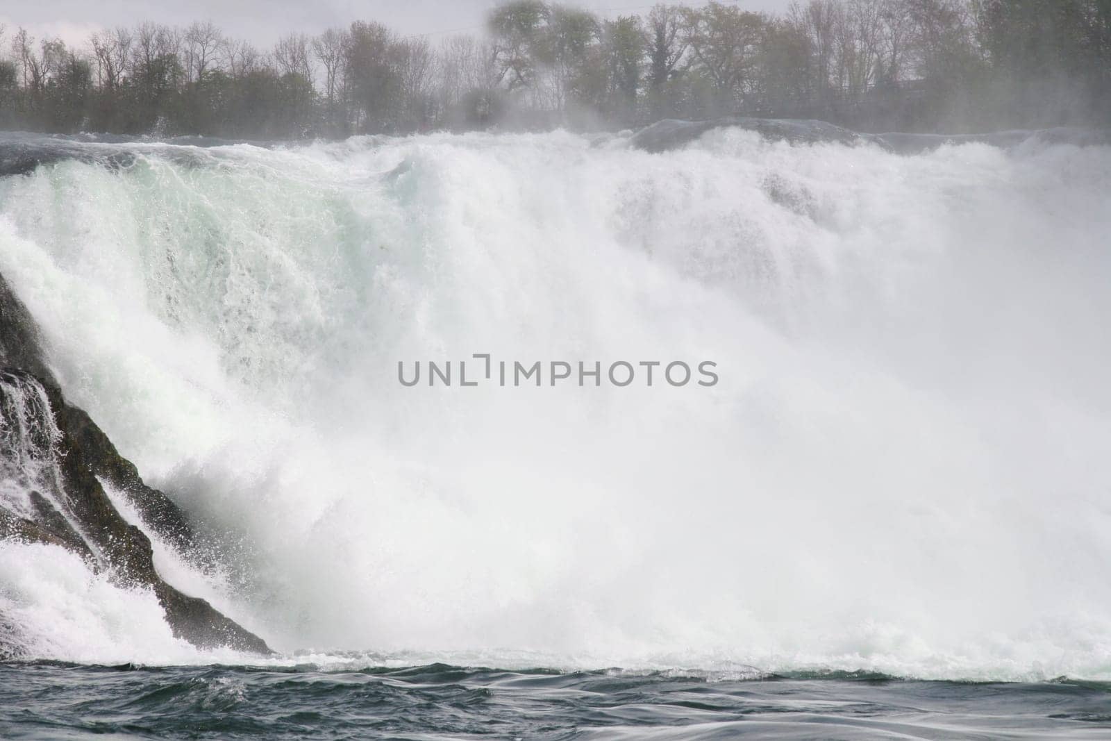 Waterfall with white,foaming spray