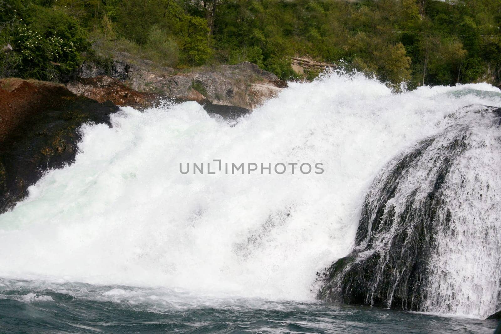 Waterfall with white,foaming spray