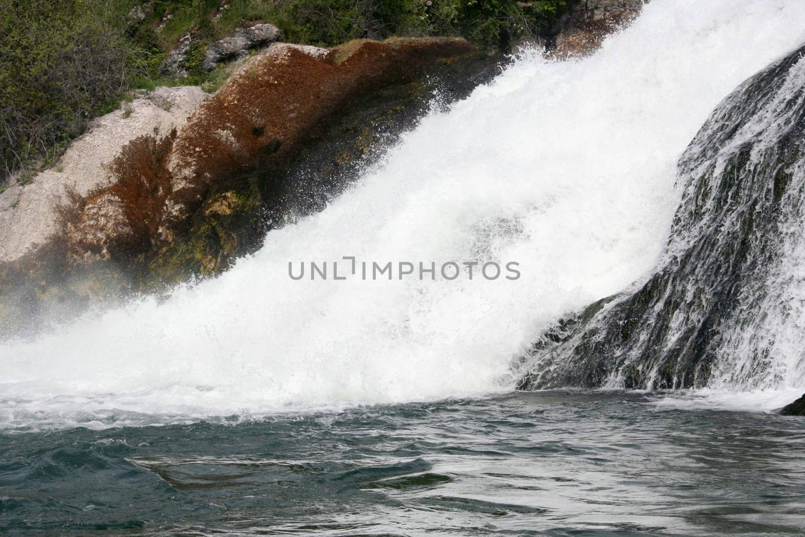 Waterfall with white,foaming spray
