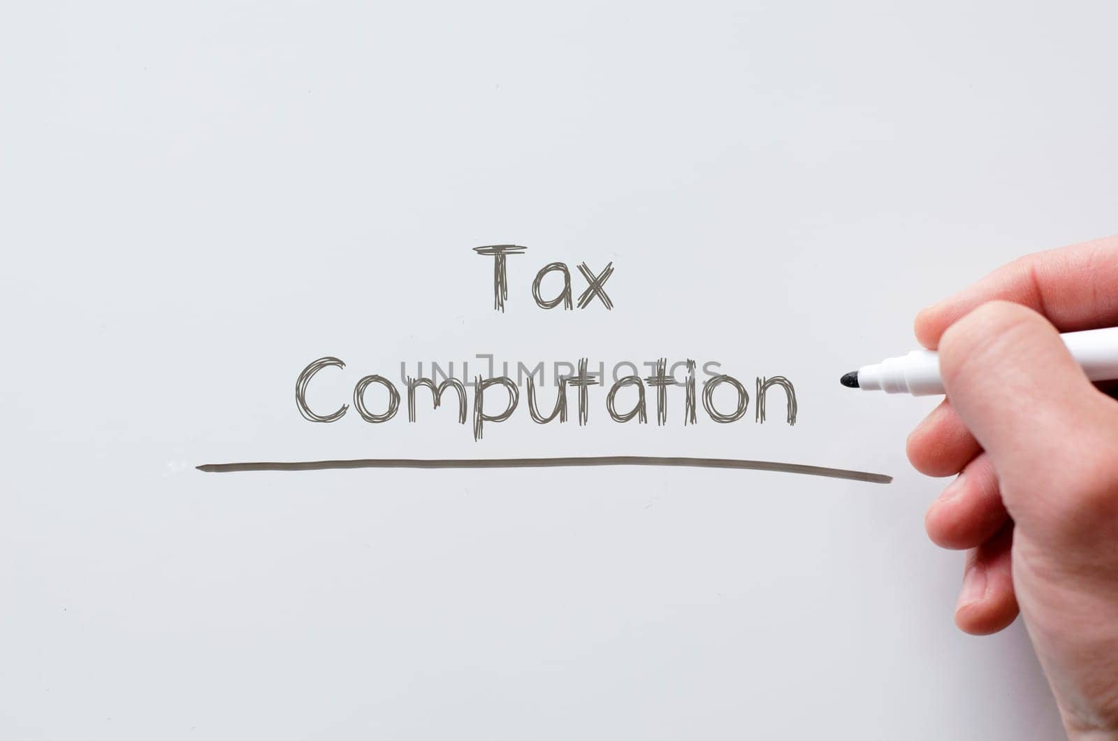 Human hand writing tax computation on whiteboard