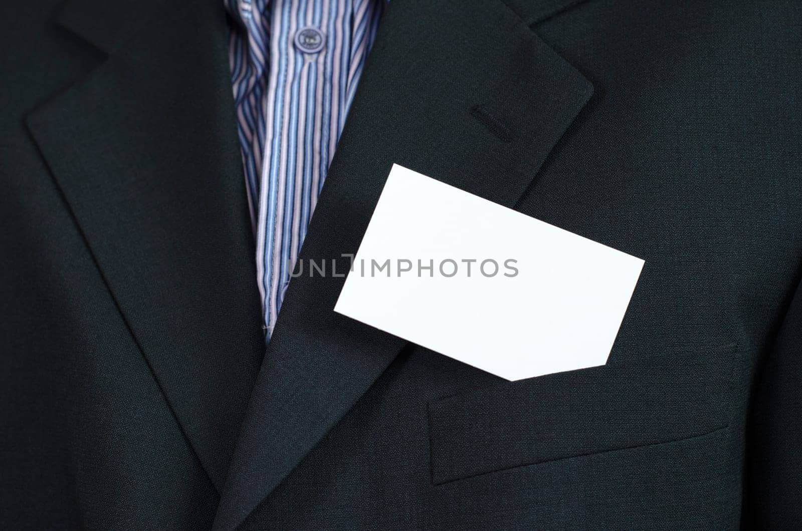 Business woman hand holding white empty note..