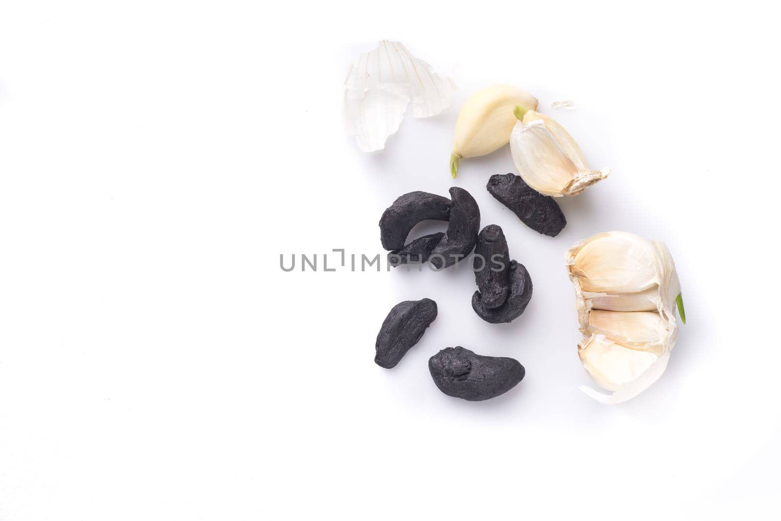 pile of black garlic, isolated on white