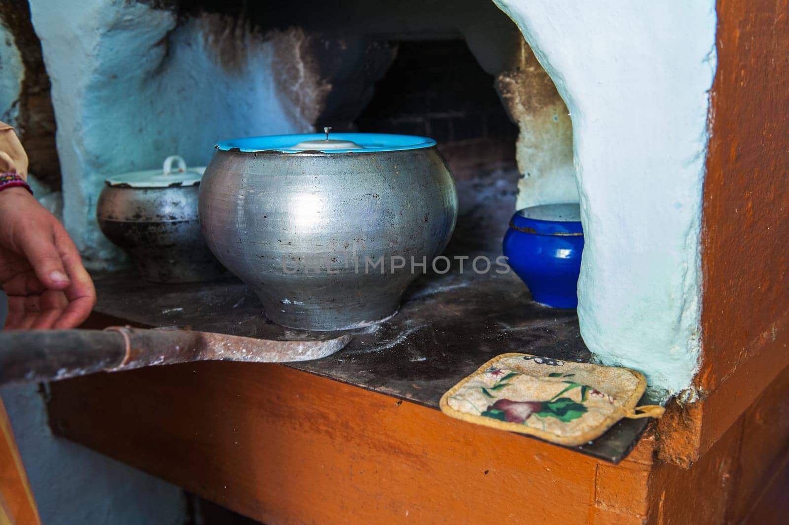 Cooking meals in a Russian stove, soup with meat and groats
