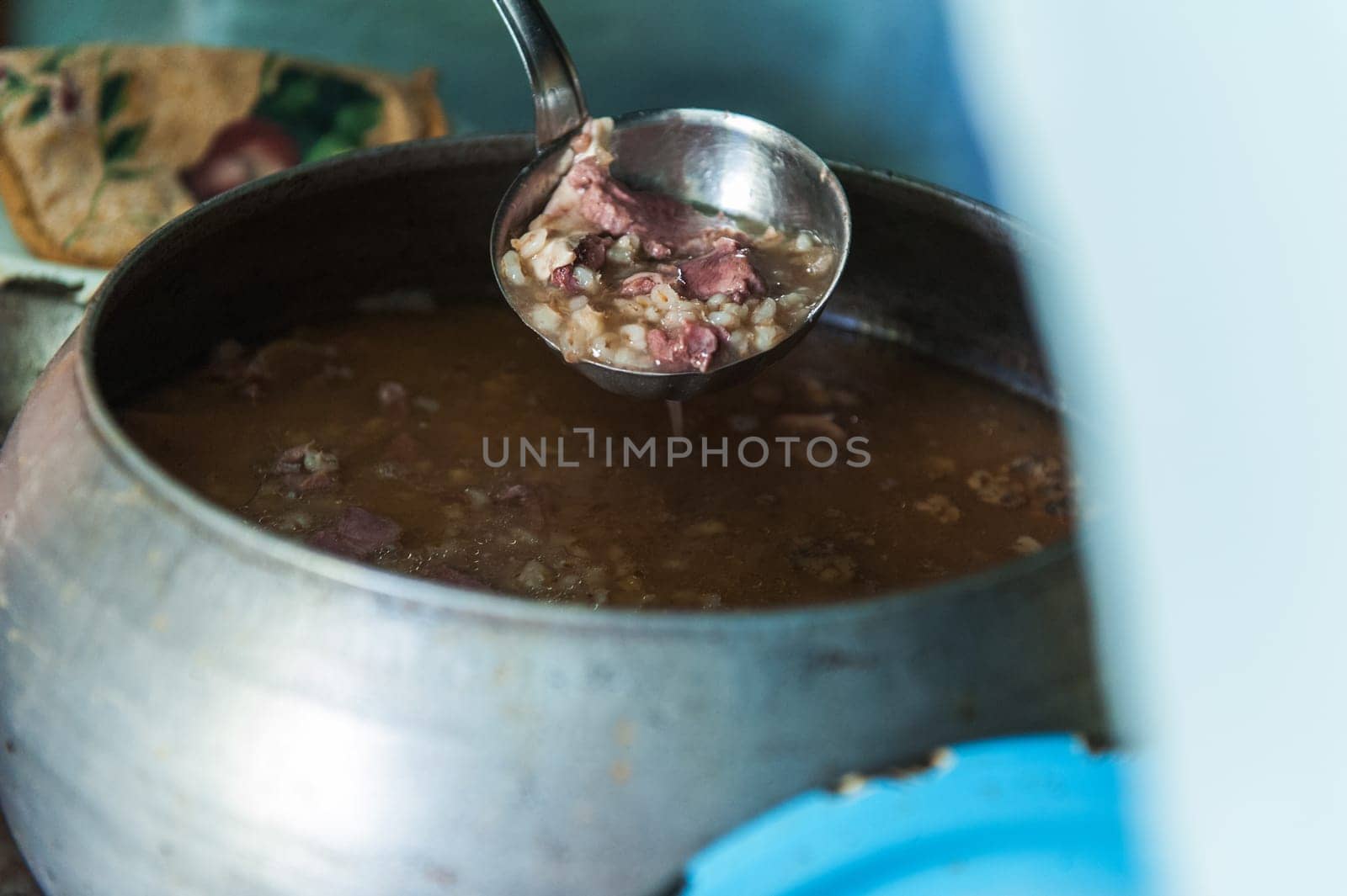 Cooking meals in a Russian stove, soup with meat and groats