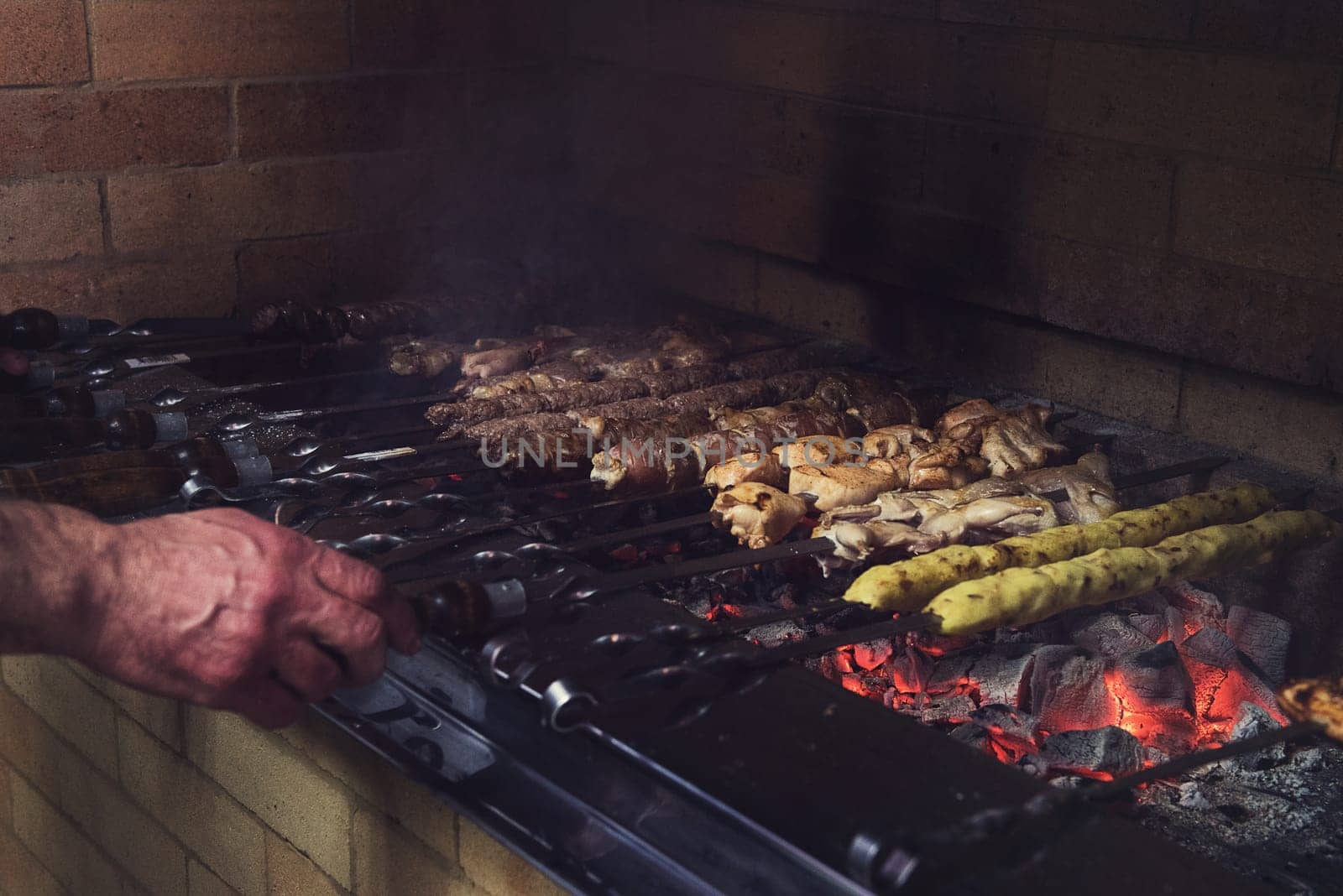 Grilling marinated shashlik on a grill