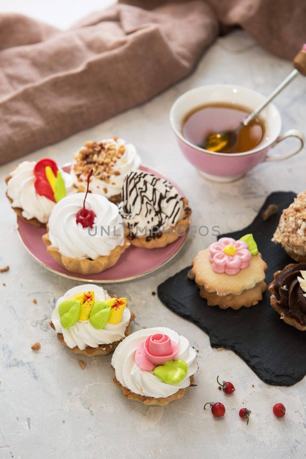Different cakes composition on concrete background