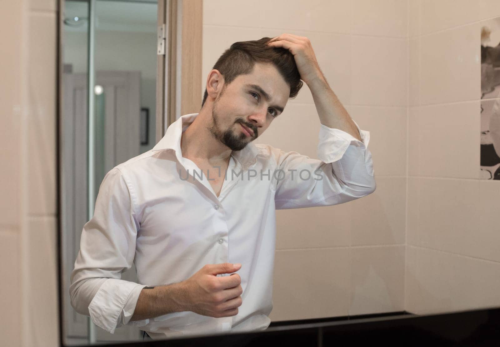 Handsome man care about hair