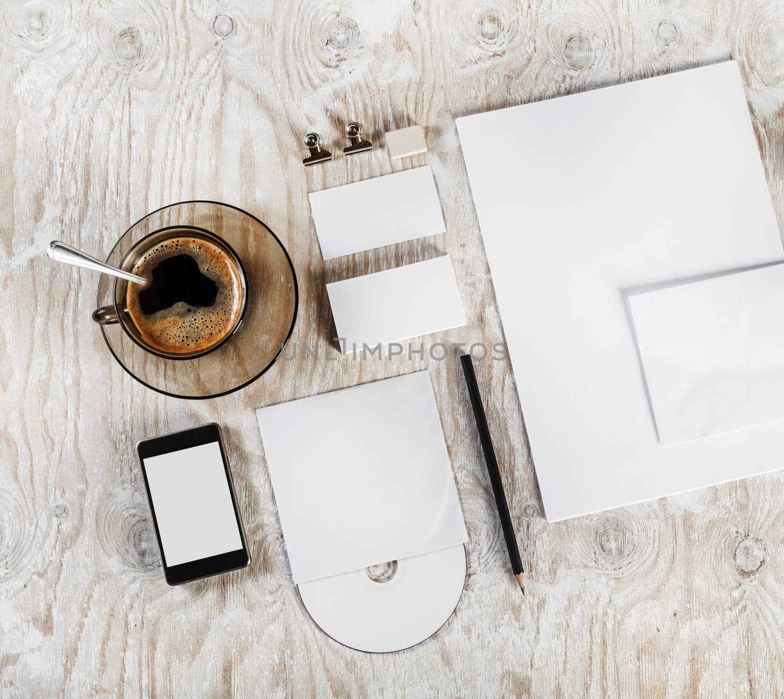 Photo. Blank stationery and corporate identity set on light wooden table background. Template for ID. Blank objects for placing your design. Top view.