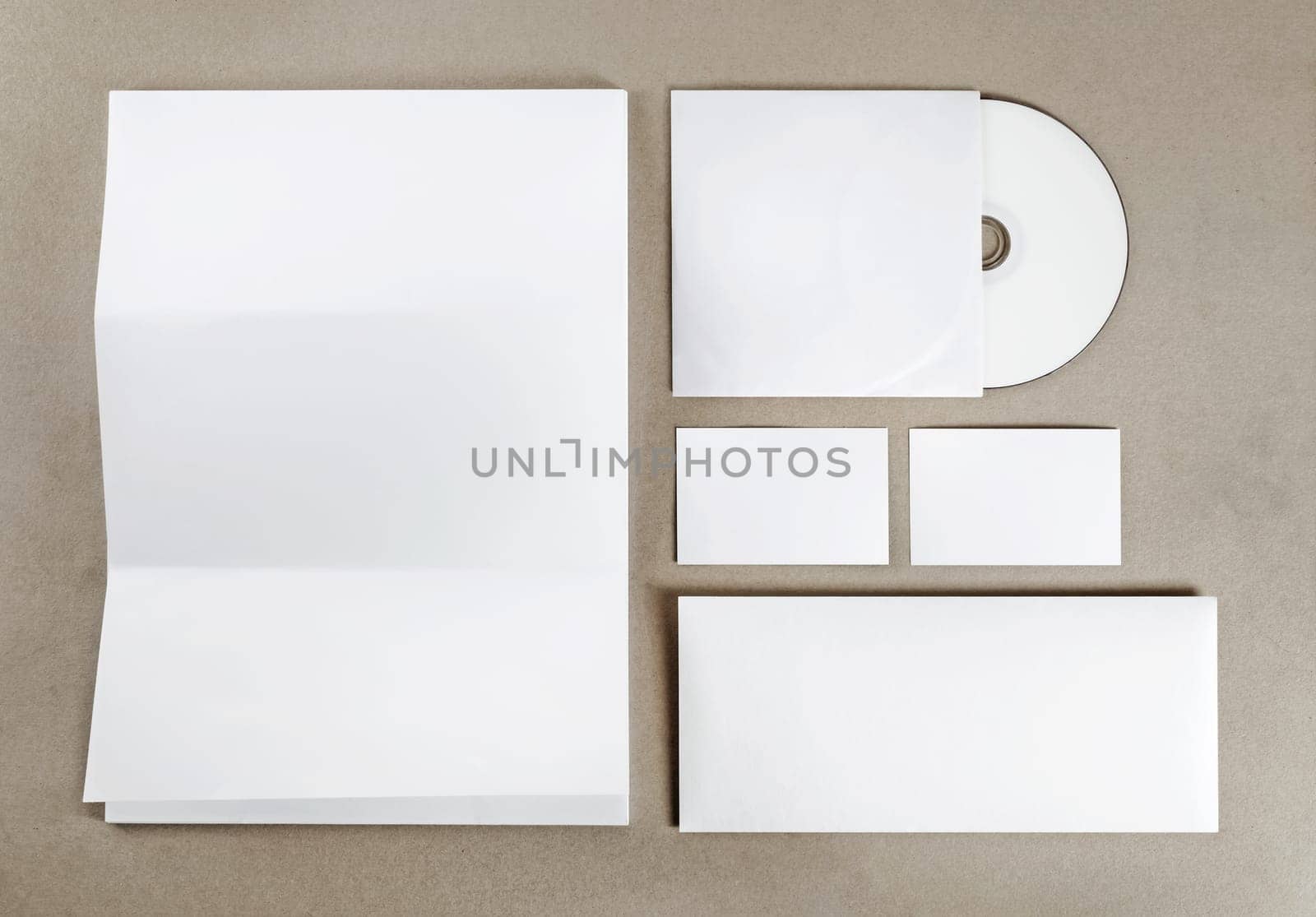 Blank stationery set. Corporate identity template on kraft paper background. Blank objects for placing your design. Top view.