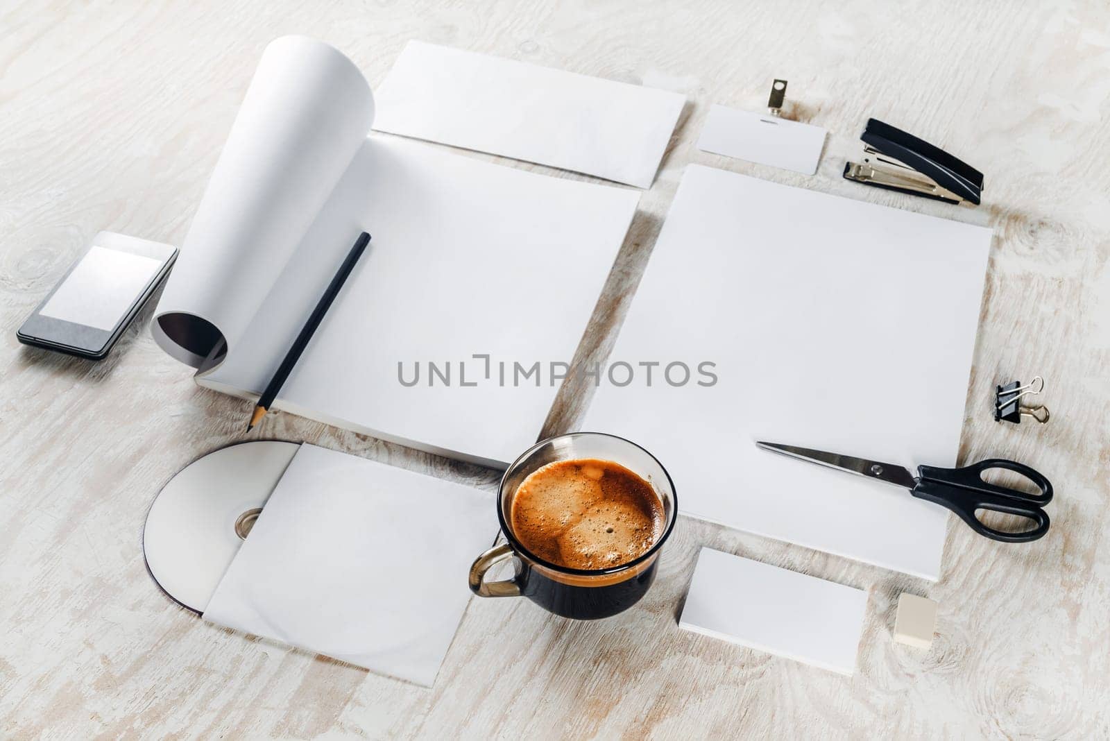 Blank stationery and corporate id template on light wooden table background. Blank objects for placing your design.