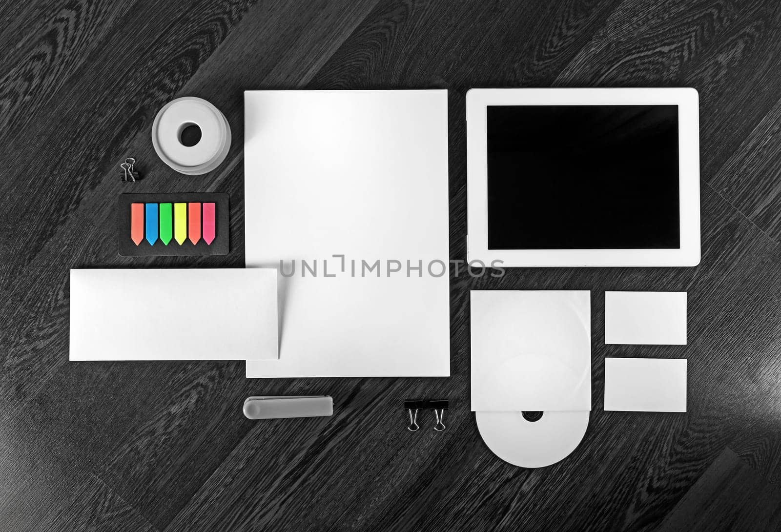 Corporate identity template on wooden table background. Photo of blank stationery set for placing your design. Top view.