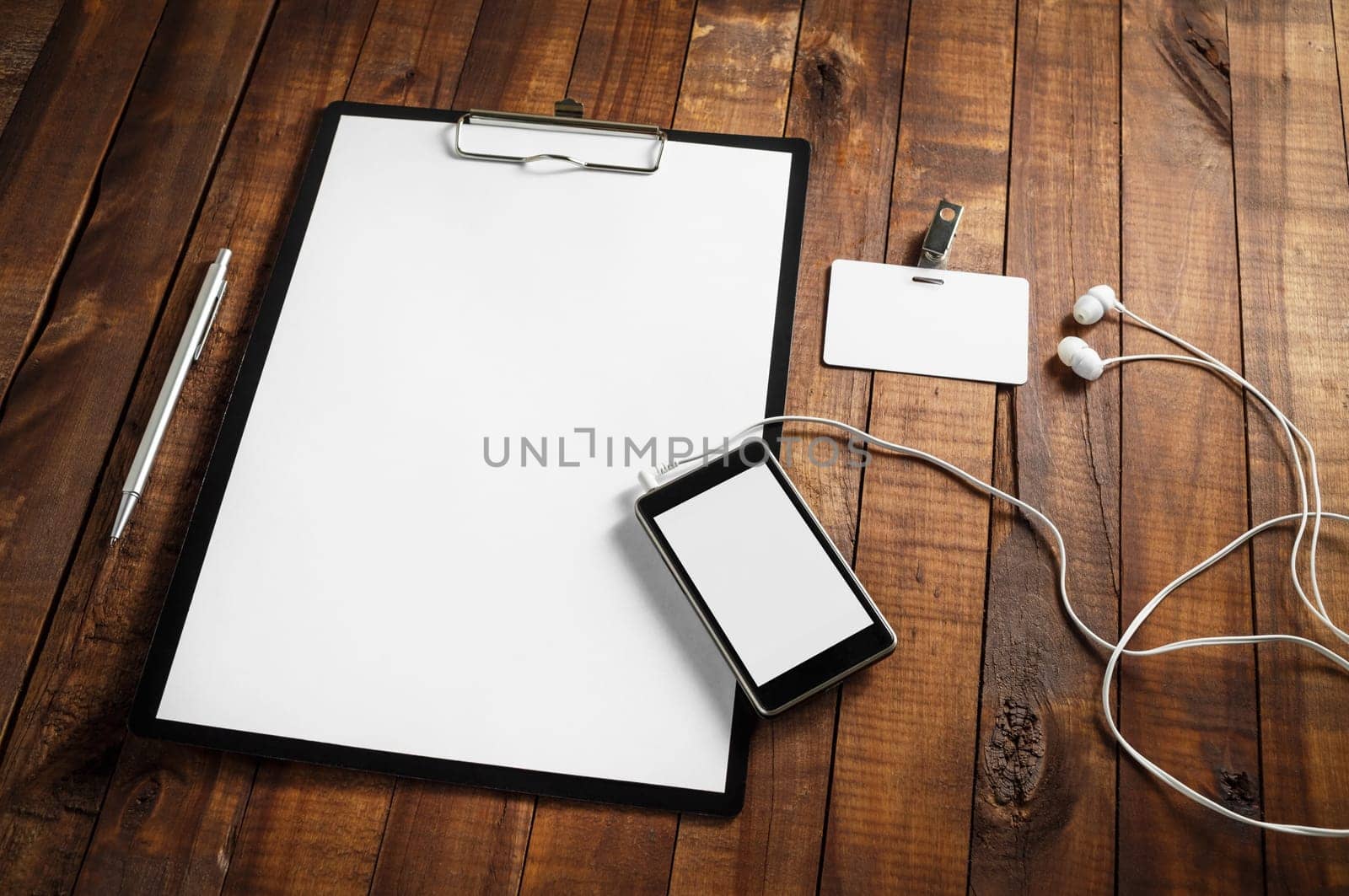 Mockup business template with plenty of copy space on vintage wooden table background. Blank objects for placing your design.