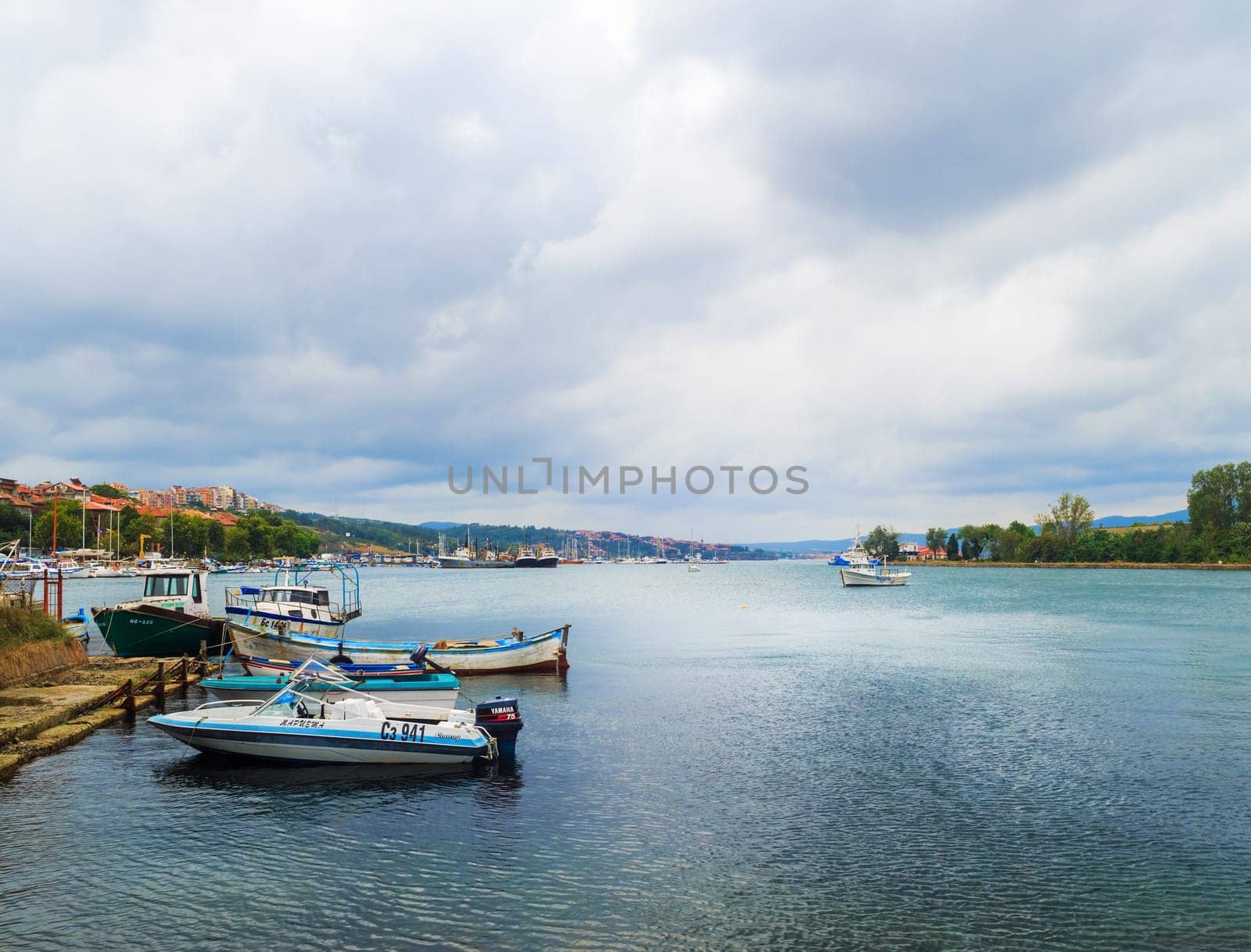Sozopol, Bulgaria - September 06, 2014: Fishing boats at the pier in the harbor of the old Old town of Sozopol, Bulgaria. Bulgarian Black Sea Coast.