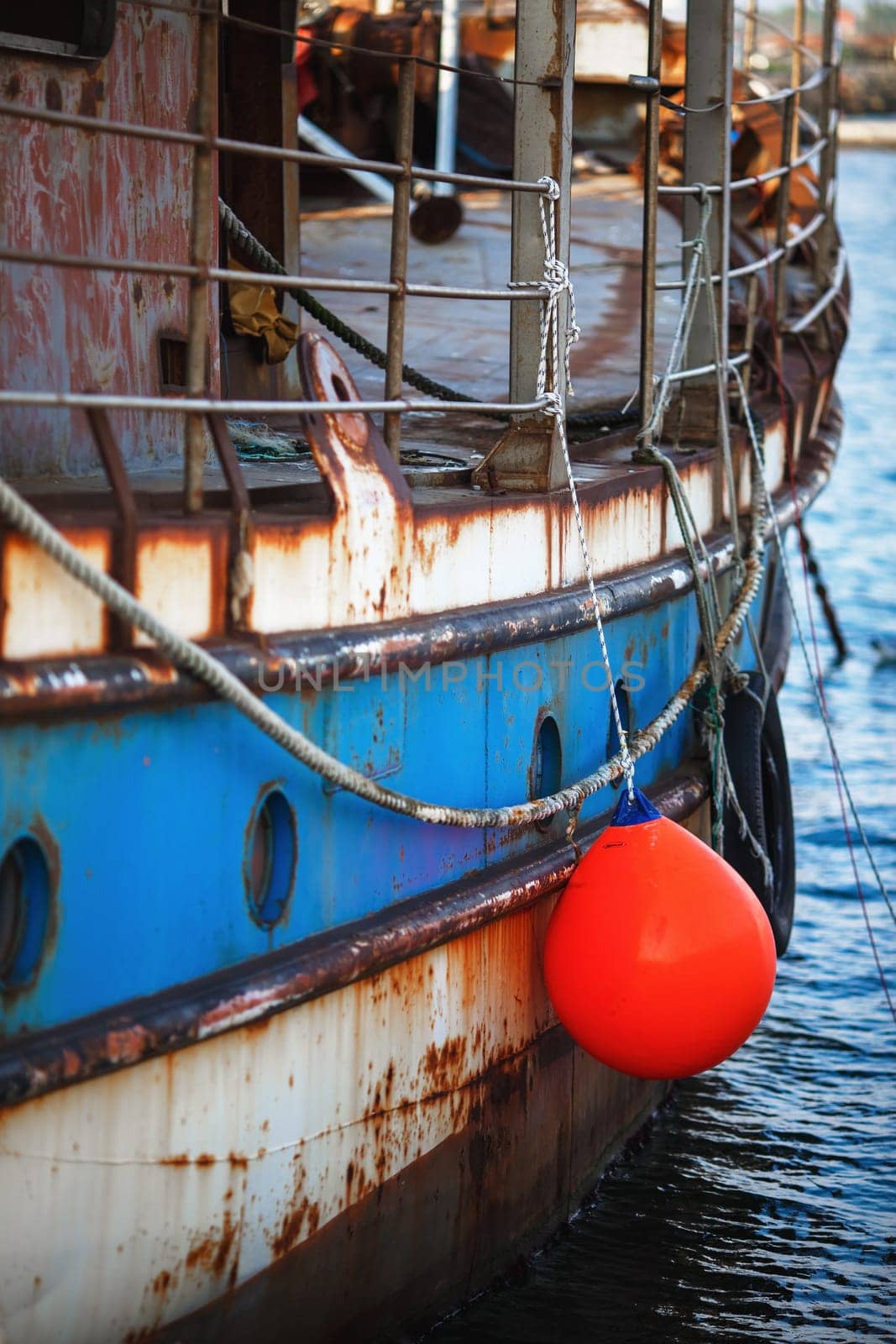 Close-up of the board of the old rusty ship. Disused marine vessel. Selective focus.