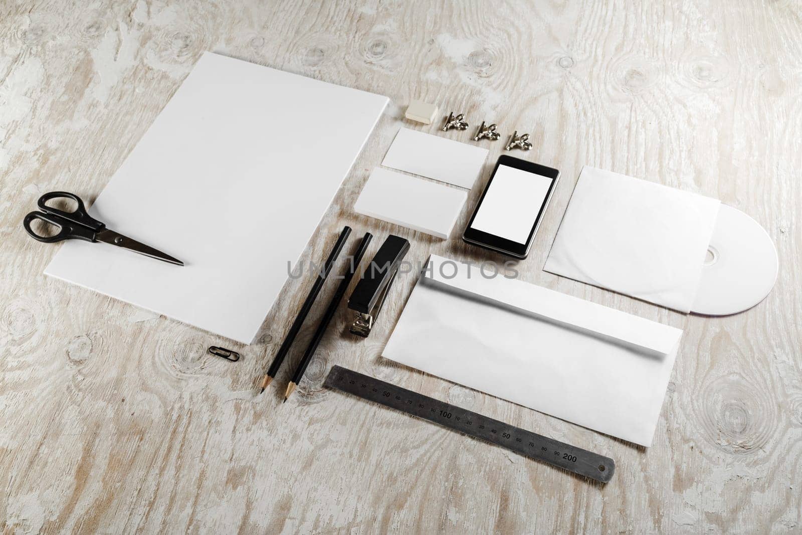 Blank corporate identity template on light wooden background. For design presentations and portfolios.
