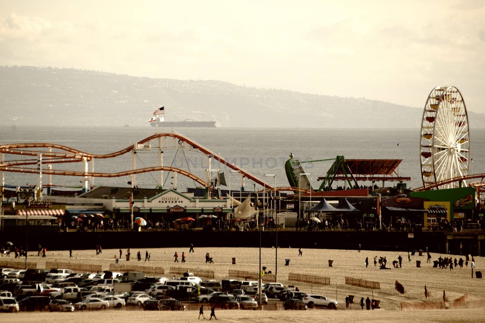 Santa Monica,United States - December 28,2015: Santa Monica Beach and Santa Monica Pier with visitors and tourists on December 28,2015 in Santa Monica.