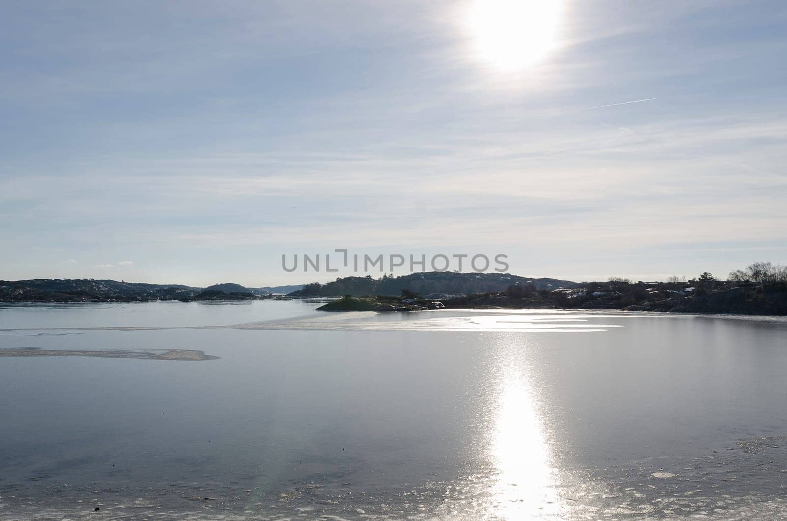 the sun is shining over the water on the swedish westcoast