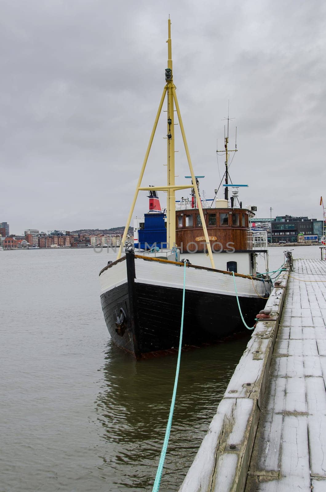 one old boat on a pier in Gothenburgs harbour