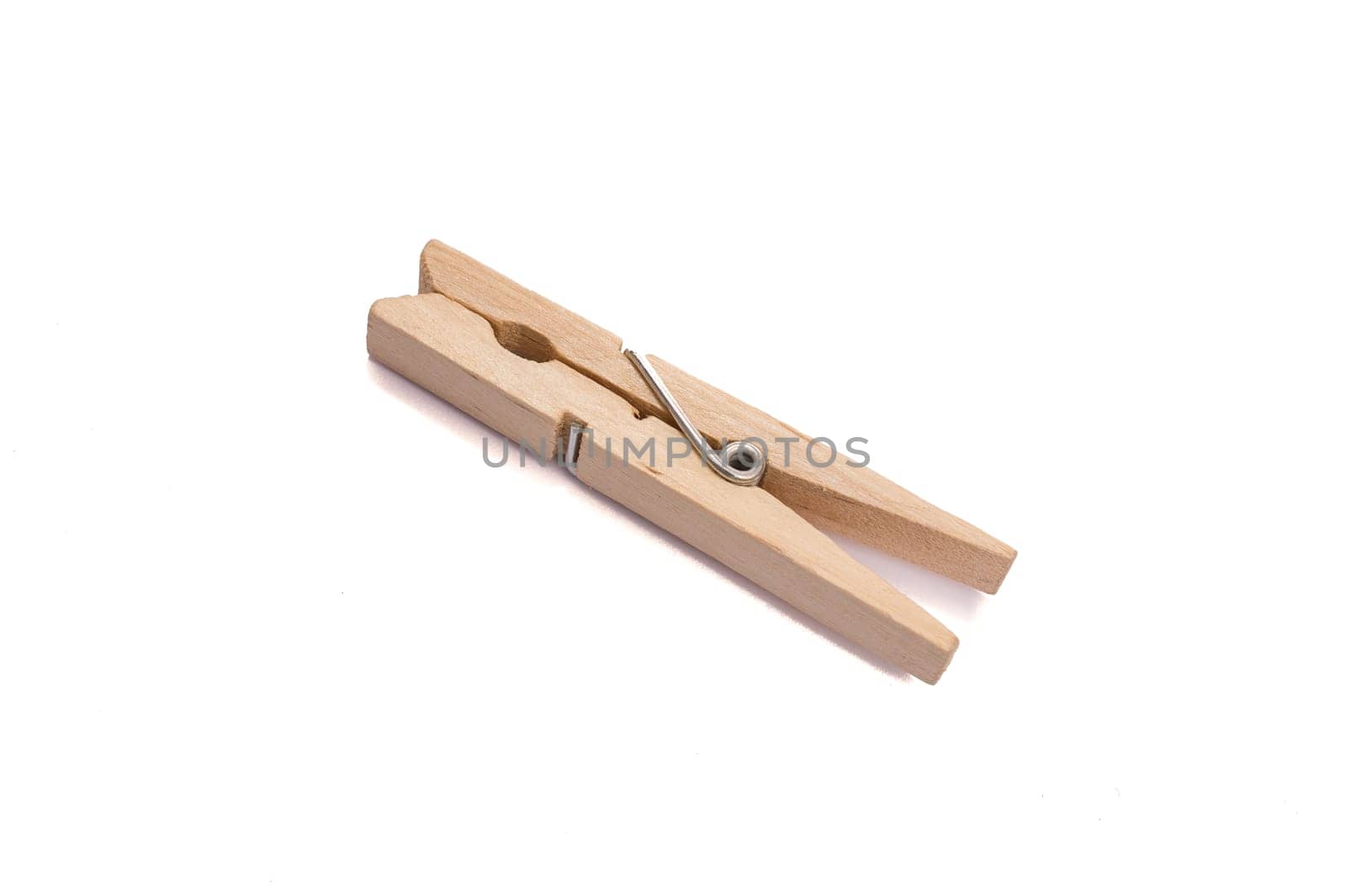 Wooden clothespin with metal spring as cropped