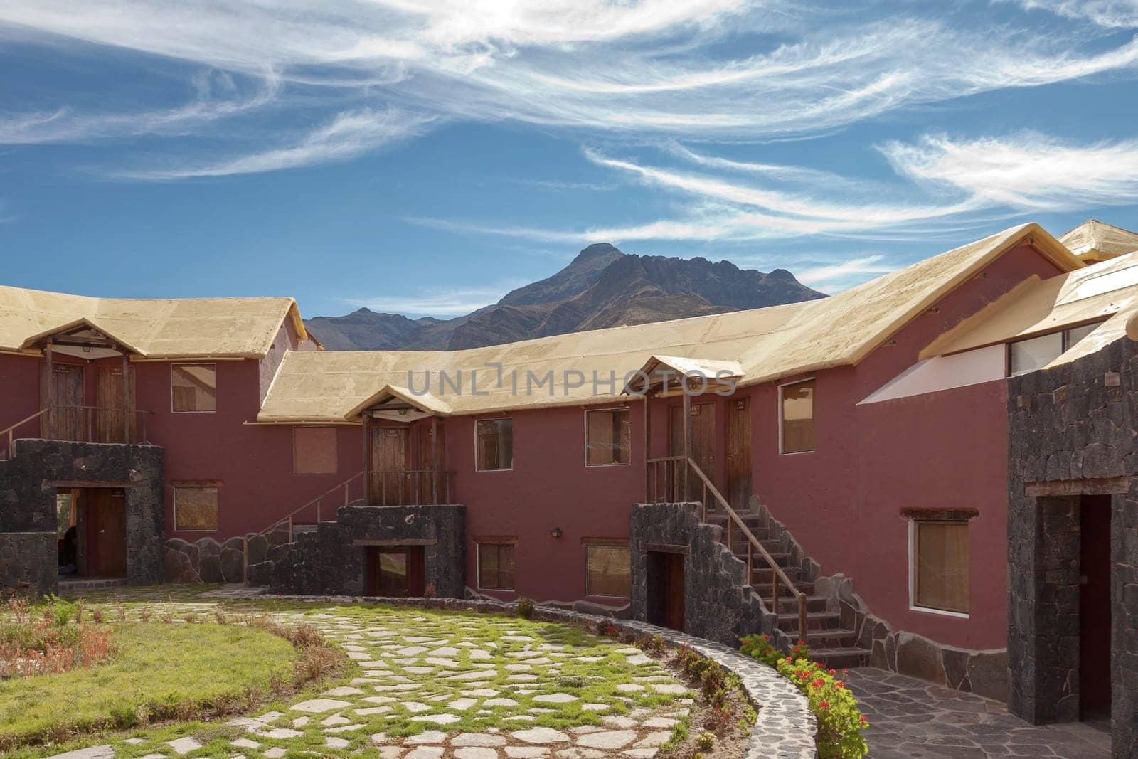 CHIVAY, AREQUIPA, PERU - NOVEMBER 25, 2015: A traditional vintage hotel in Chivay, Arequipa Peru with mountains and blue sky.