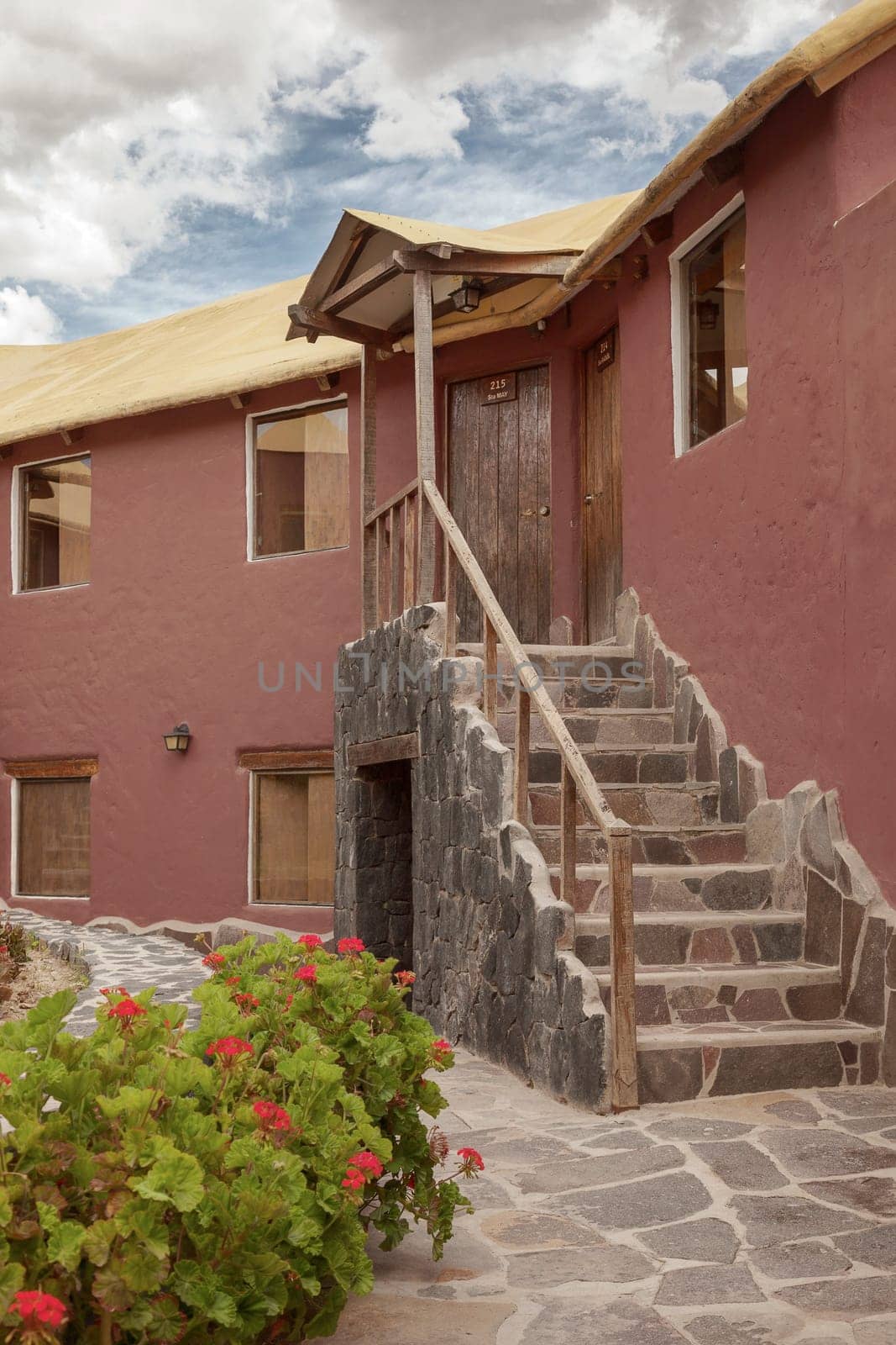 CHIVAY, AREQUIPA, PERU - NOVEMBER 25, 2015: A traditional vintage hotel in Chivay, Arequipa Peru with clouds.