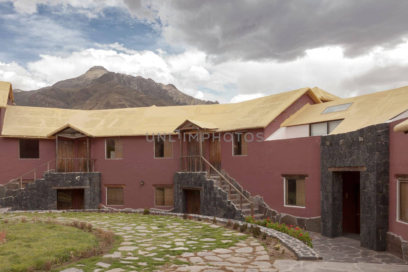 CHIVAY, AREQUIPA, PERU - NOVEMBER 25, 2015: A traditional vintage hotel in Chivay, Arequipa Peru with clouds.