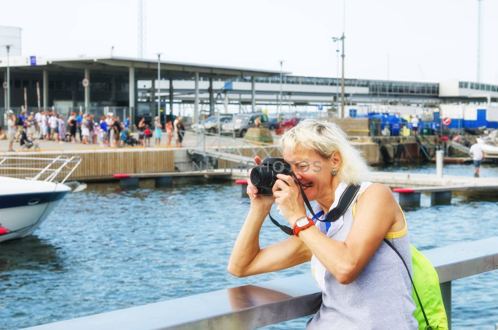 Woman photographs on the quay