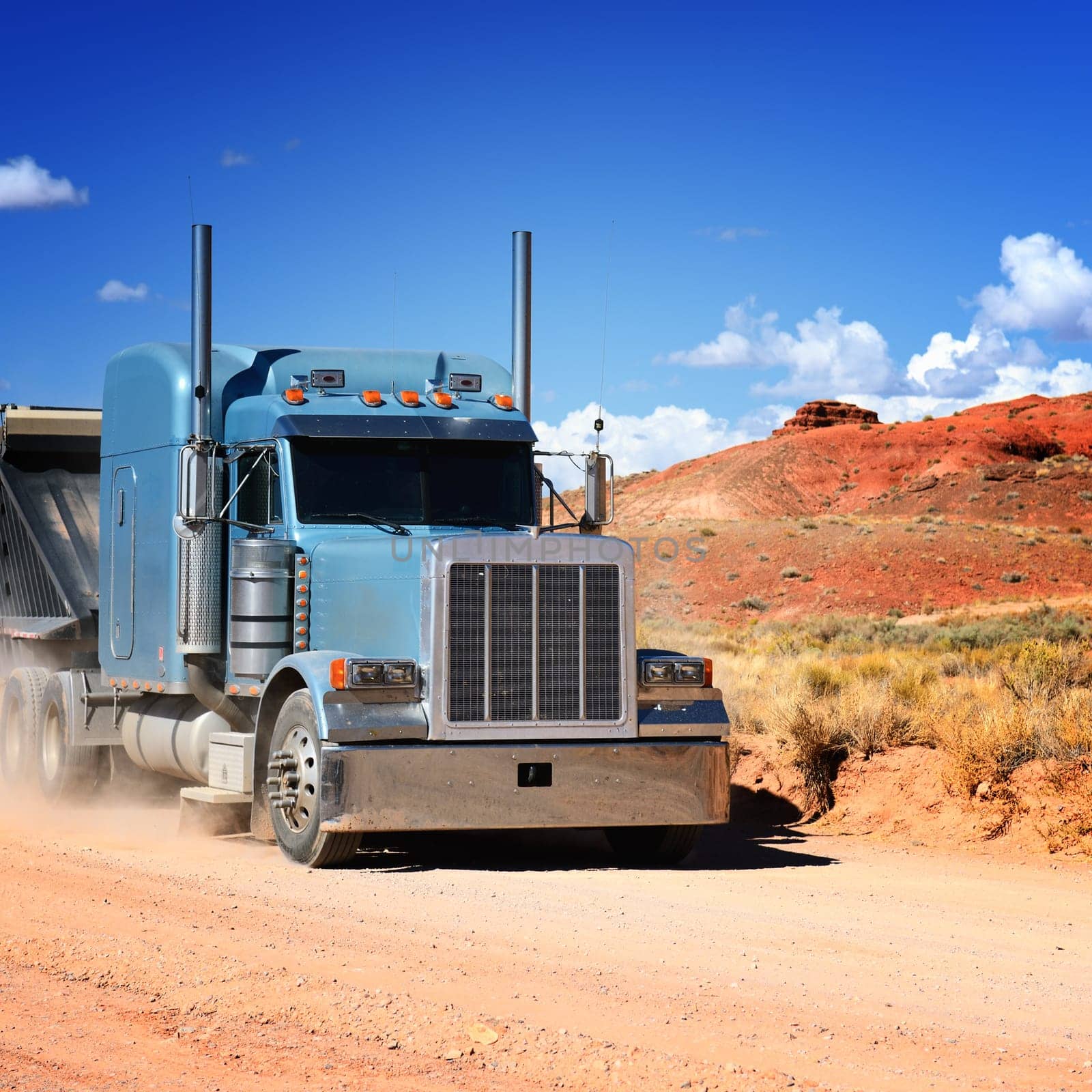 Semi-truck driving across the desert, USA