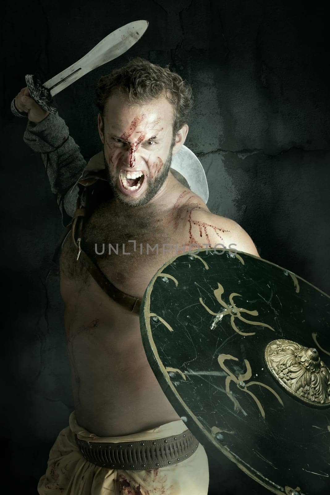Ancient warrior or Gladiator posing against a dark background with sword