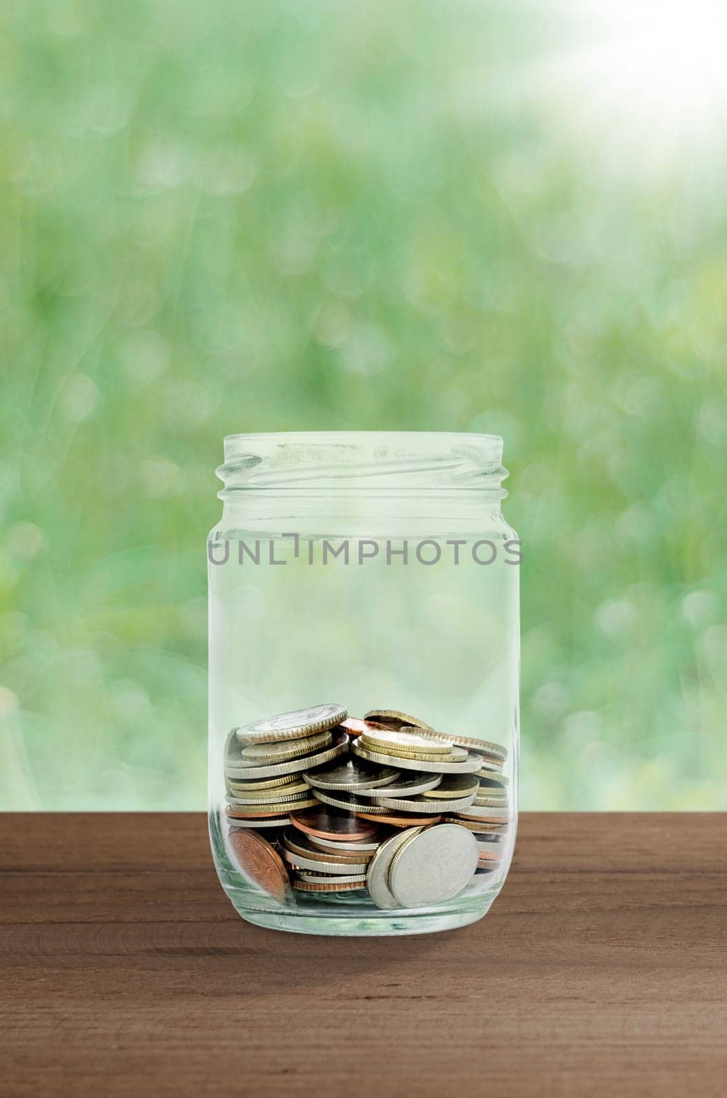 money in the glass. save money for investment concept.