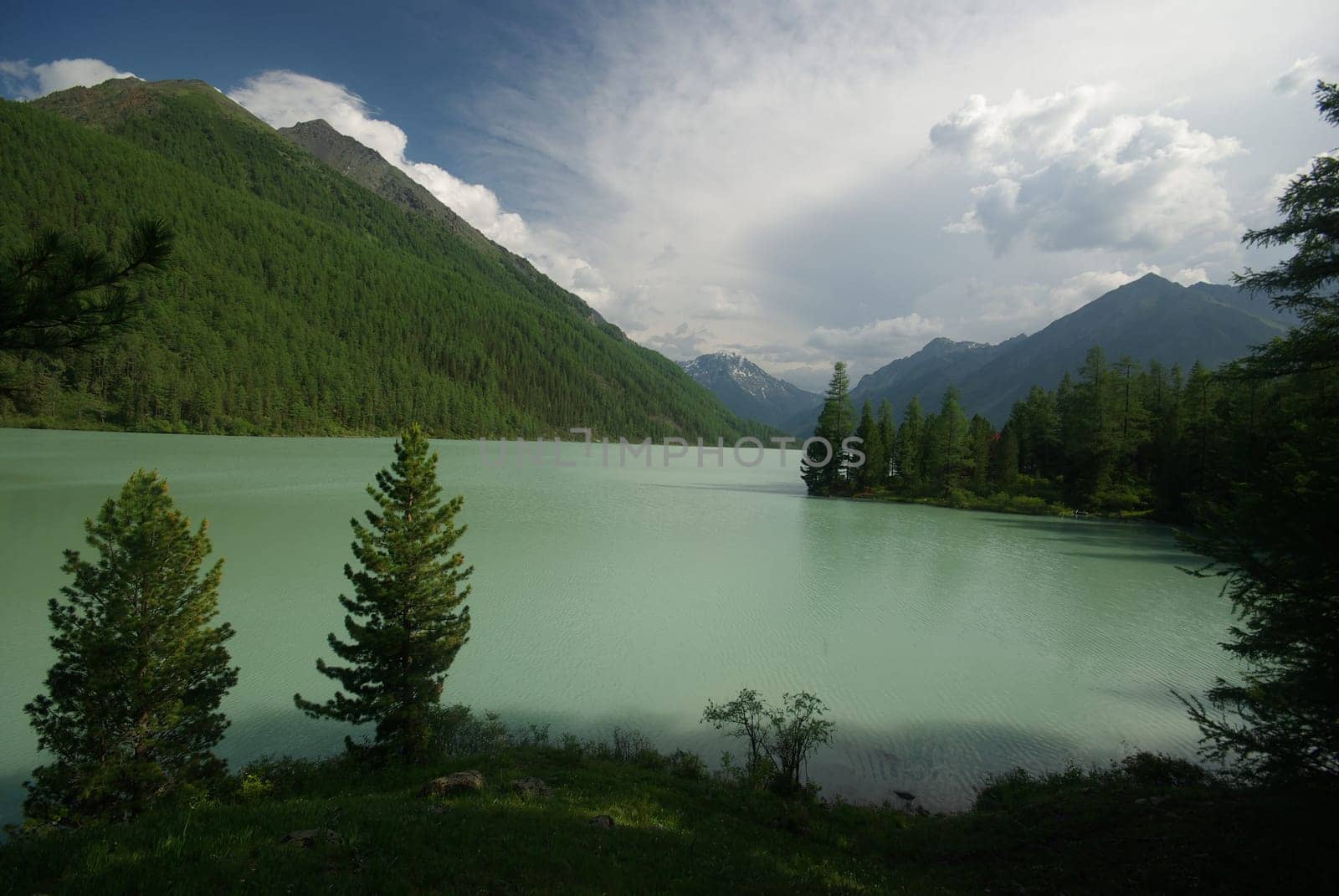 Beautiful mountain landscape near the lake. Mountain Lake. Kind of mountainous terrain and the water in the valley.