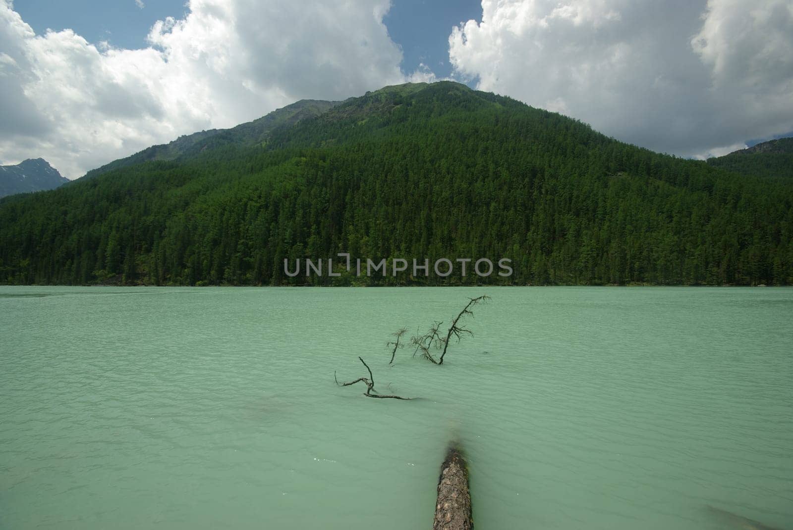 Beautiful mountain landscape near the lake. Mountain Lake. Kind of mountainous terrain and the water in the valley.