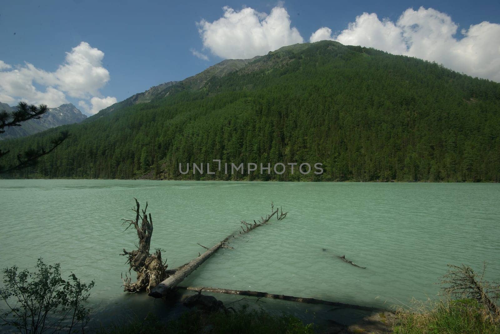 Beautiful mountain landscape near the lake. Mountain Lake. Kind of mountainous terrain and the water in the valley.