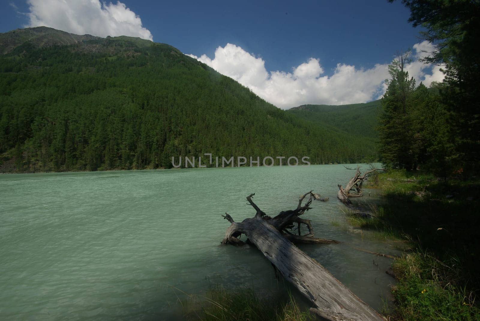 Beautiful mountain landscape near the lake. Mountain Lake. Kind of mountainous terrain and the water in the valley.