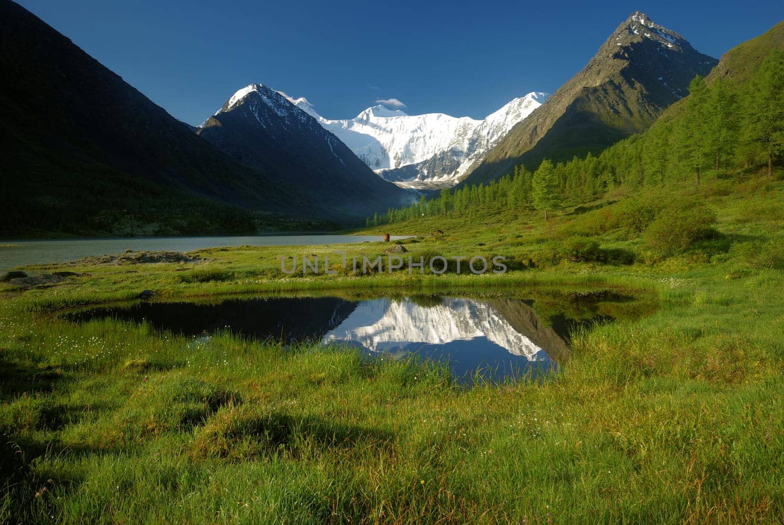 Beautiful mountain landscape near the lake. Mountain Lake. Kind of mountainous terrain and the water in the valley.